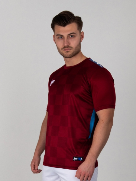Man is wearing a chequered claret football shirt with claret trim
