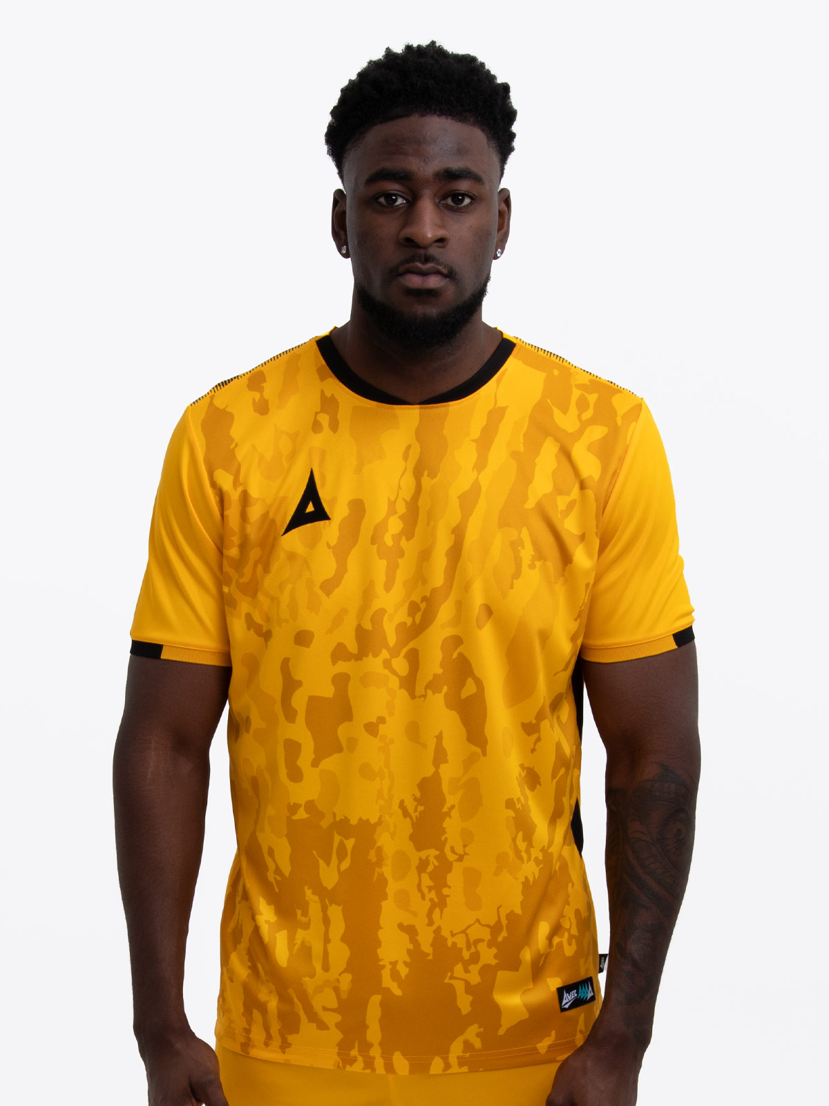 model wearing an amber and black sports football training t-shirt.