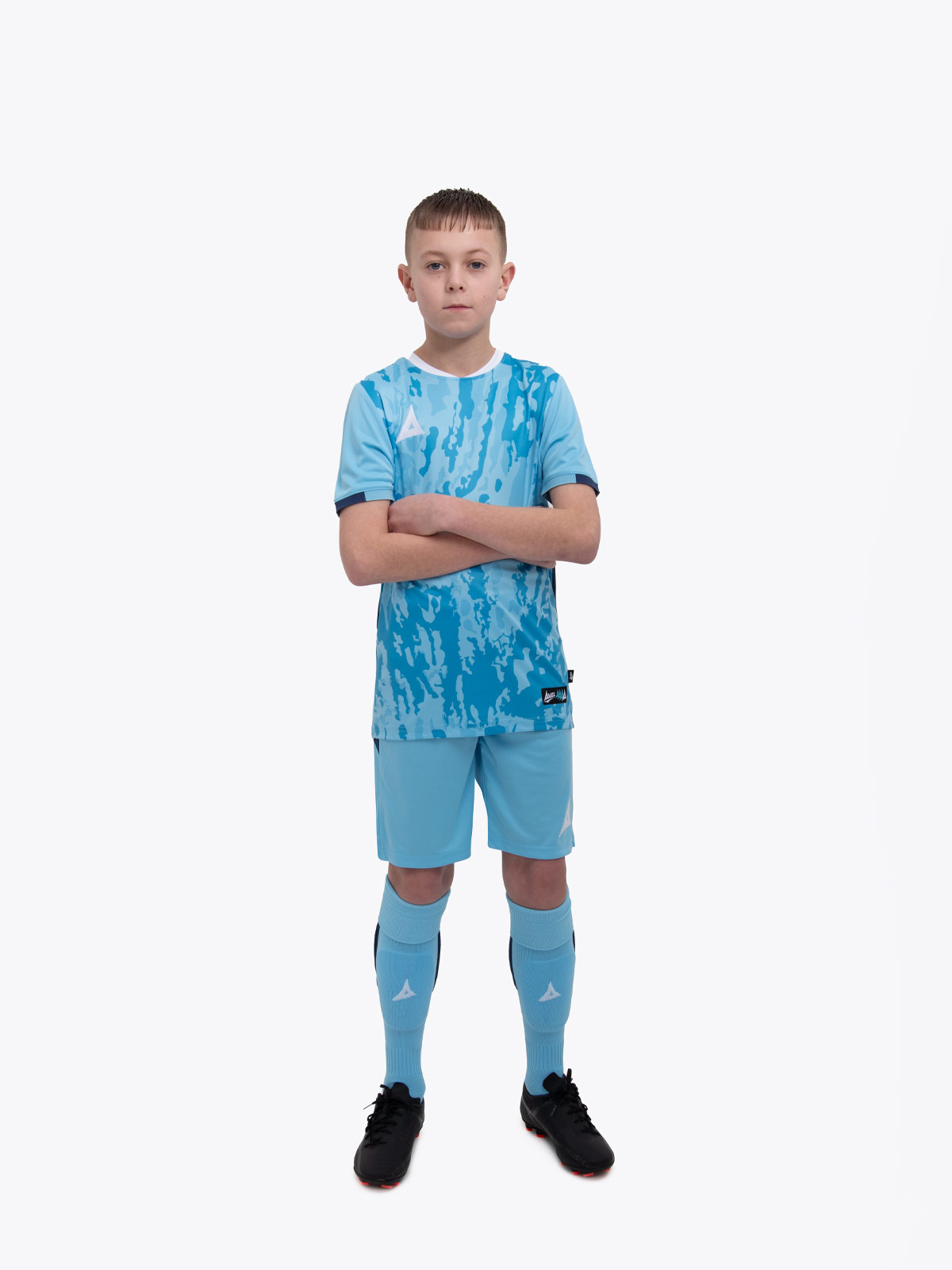 a kids football kit in sky and navy with stripes and matching sky shorts and socks