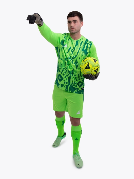 A model standing up wearing a neon green goalkeeper football shirt, matching Shorts and Football Socks.