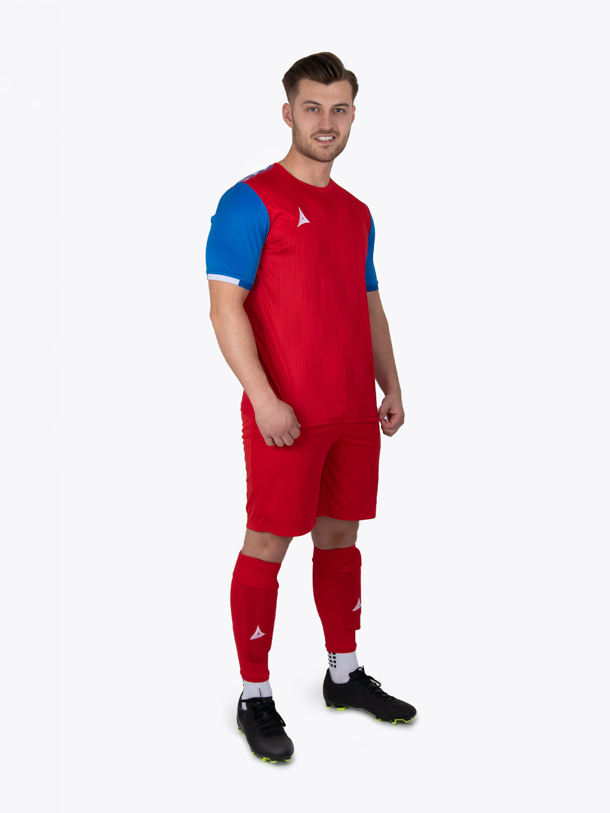 a model is wearing a red and royal blue football kit 